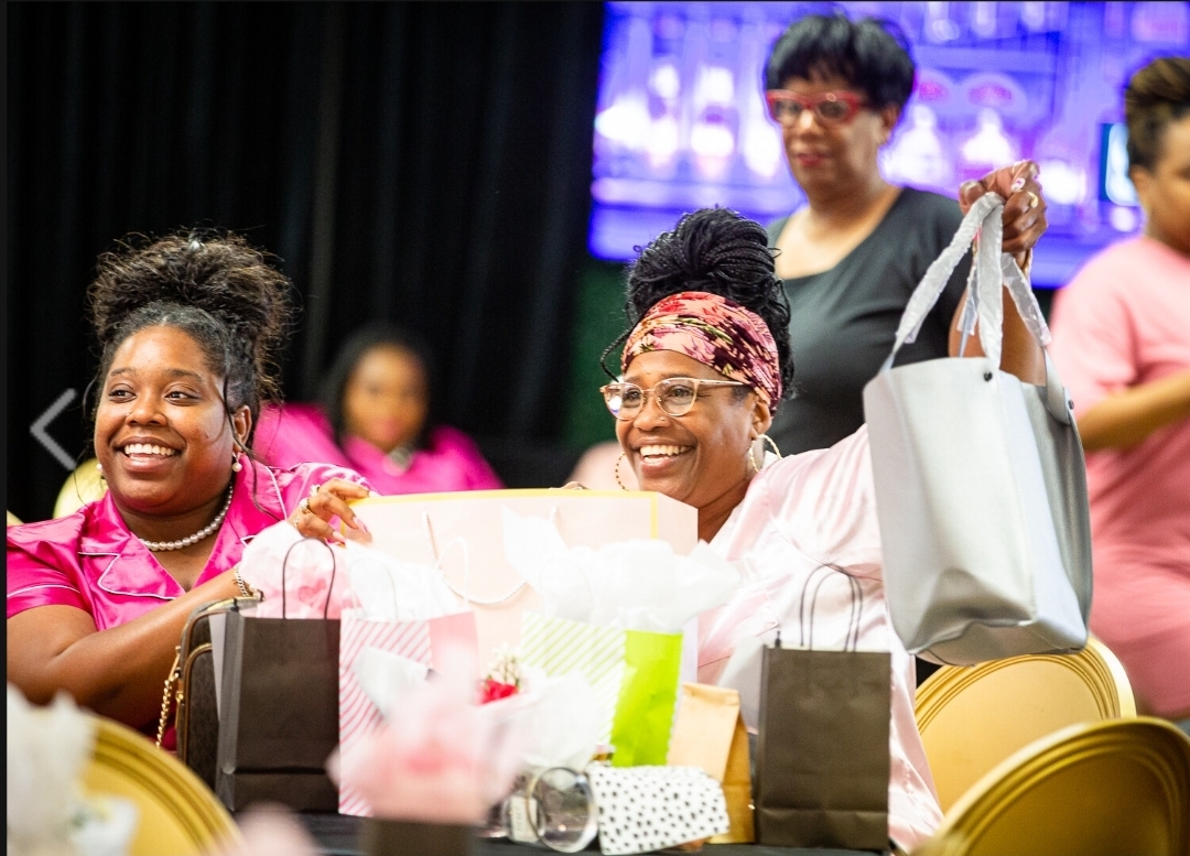 Chat & Chew gift moment with smiling attendees