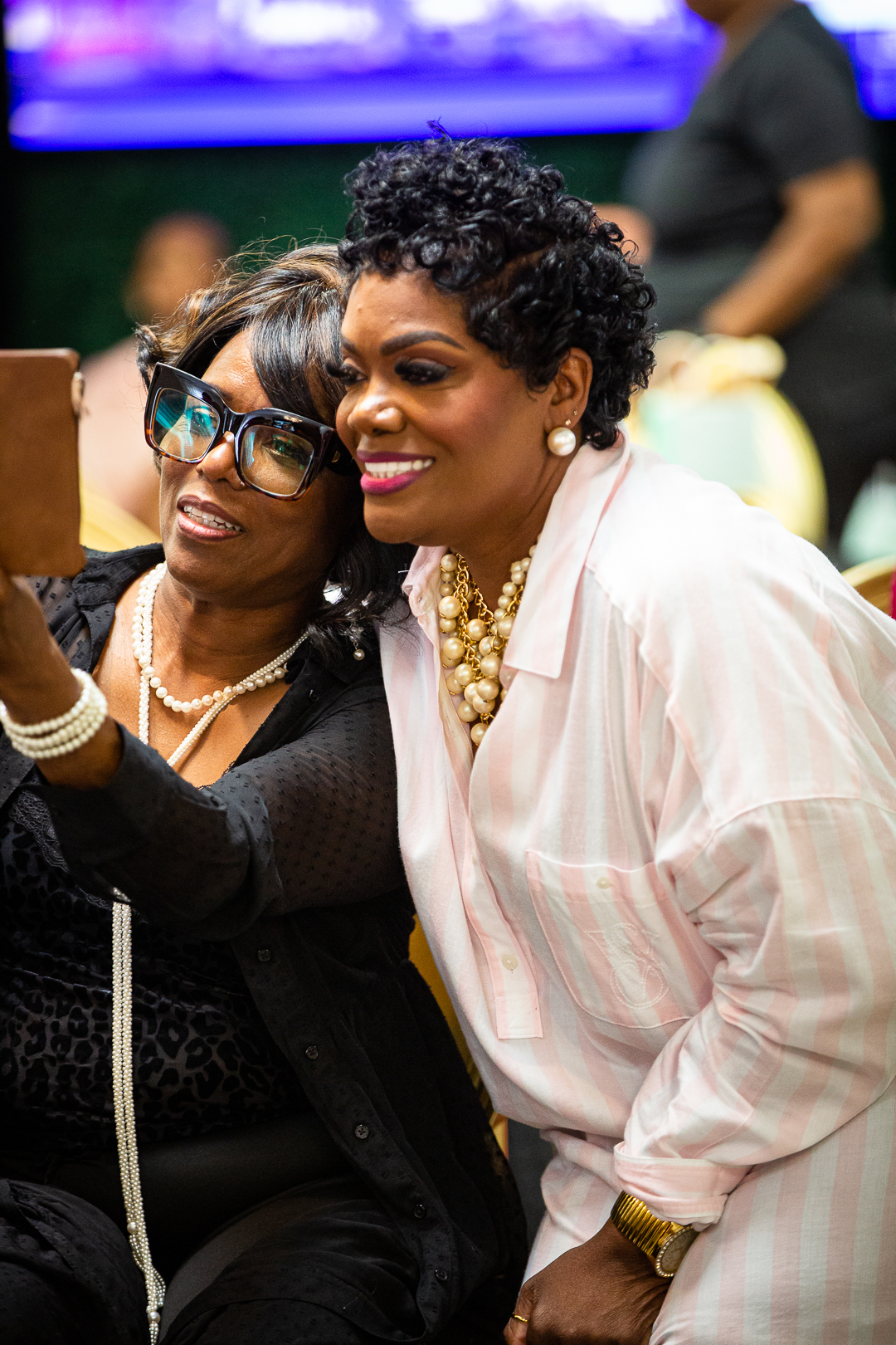 Two Chat & Chew guests sharing a selfie in the audience