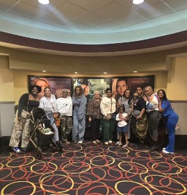 Chat & Chew community group photo at a movie outing