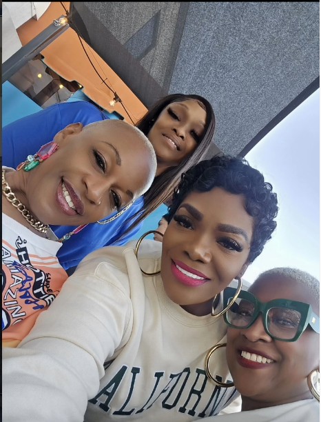 Chat & Chew sisterhood selfie at a rooftop gathering
